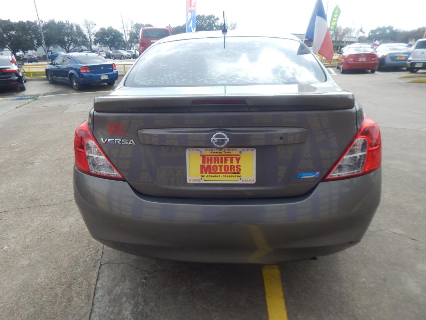 2014 BROWN NISSAN VERSA 1.6 S 5M (3N1CN7AP4EL) with an 1.6L L4 DOHC 16V engine, 5-SPEED MANUAL transmission, located at 16710 Clay Rd., Houston, TX, 77084, (281) 859-7900, 0.000000, 0.000000 - Low Donw. Low Payments. - Photo#5