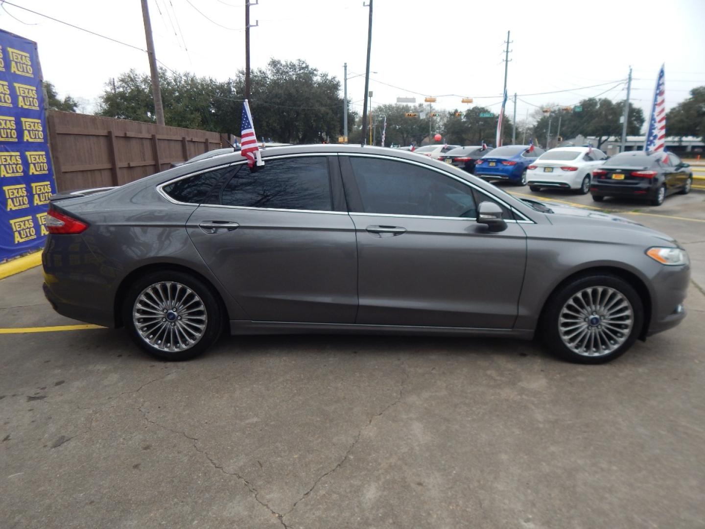 2014 GRAY Ford Fusion Titanium (3FA6P0K99ER) with an 2.0L L4 DOHC 16V engine, located at 16710 Clay Rd., Houston, TX, 77084, (281) 859-7900, 0.000000, 0.000000 - Low Donw. Low Payments. - Photo#4