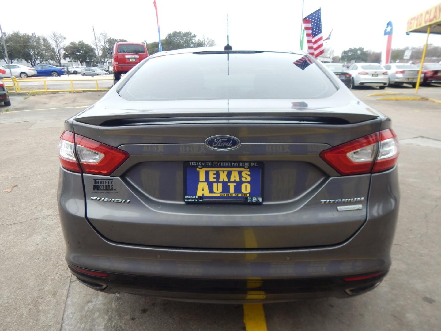 2014 GRAY Ford Fusion Titanium (3FA6P0K99ER) with an 2.0L L4 DOHC 16V engine, located at 16710 Clay Rd., Houston, TX, 77084, (281) 859-7900, 0.000000, 0.000000 - Low Donw. Low Payments. - Photo#5