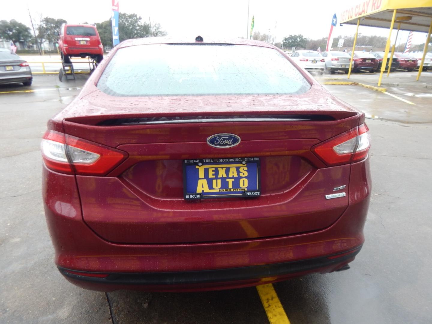 2013 RED Ford Fusion SE (3FA6P0HR6DR) with an 1.6L L4 DOHC 16V engine, located at 16710 Clay Rd., Houston, TX, 77084, (281) 859-7900, 0.000000, 0.000000 - Low Donw. Low Payments. - Photo#5