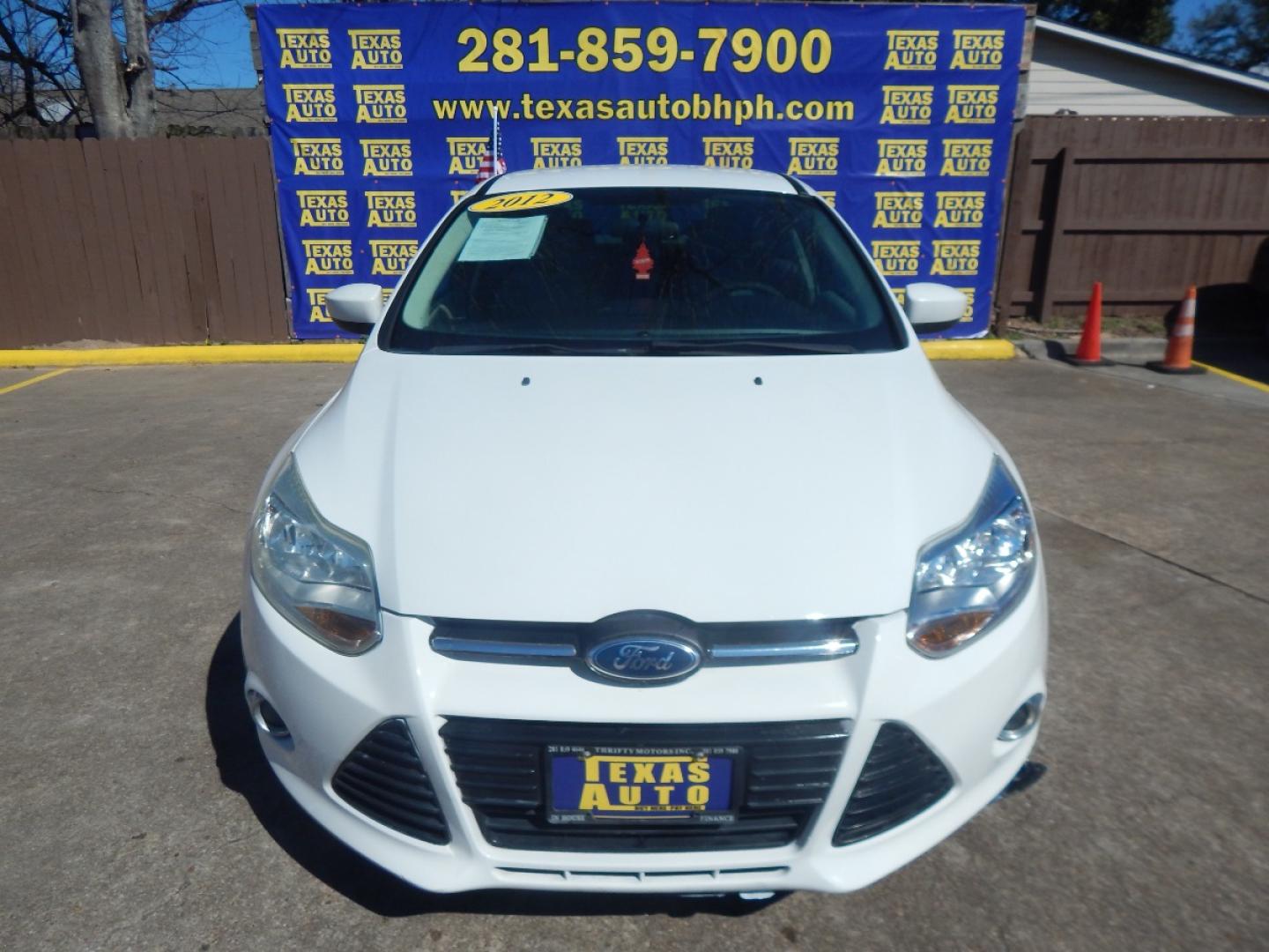 2012 WHITE Ford Focus SE Sedan (1FAHP3F26CL) with an 2.0L L4 DOHC 16V engine, located at 16710 Clay Rd., Houston, TX, 77084, (281) 859-7900, 0.000000, 0.000000 - Low Down. Low Payments. - Photo#1