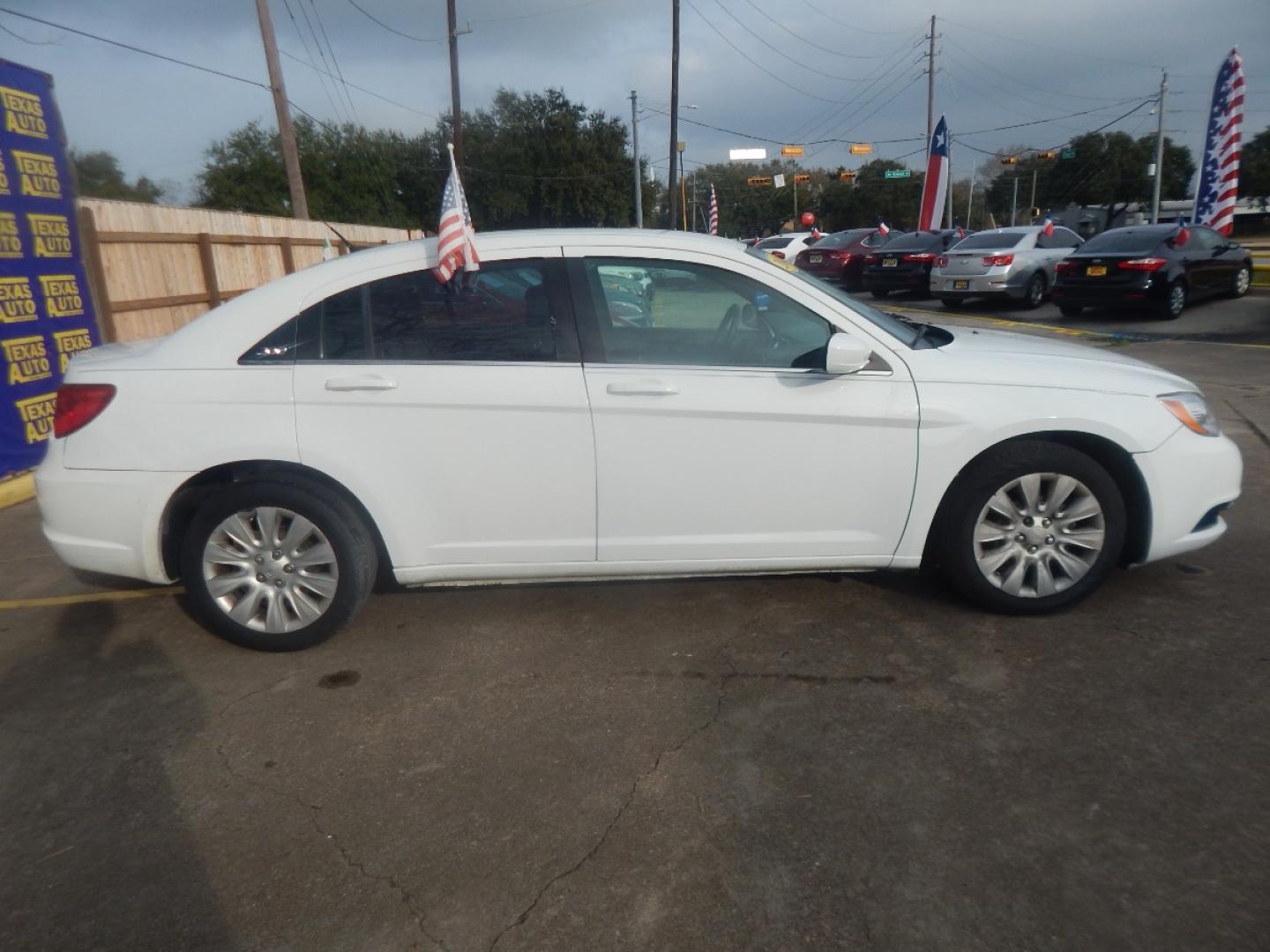 2014 WHITE CHRYSLER 200 LX (1C3CCBAGXEN) with an 3.6L V6 DOHC 24V FFV engine, 6-SPEED AUTOMATIC transmission, located at 16710 Clay Rd., Houston, TX, 77084, (281) 859-7900, 0.000000, 0.000000 - Low Donw. Low Payments. - Photo#7