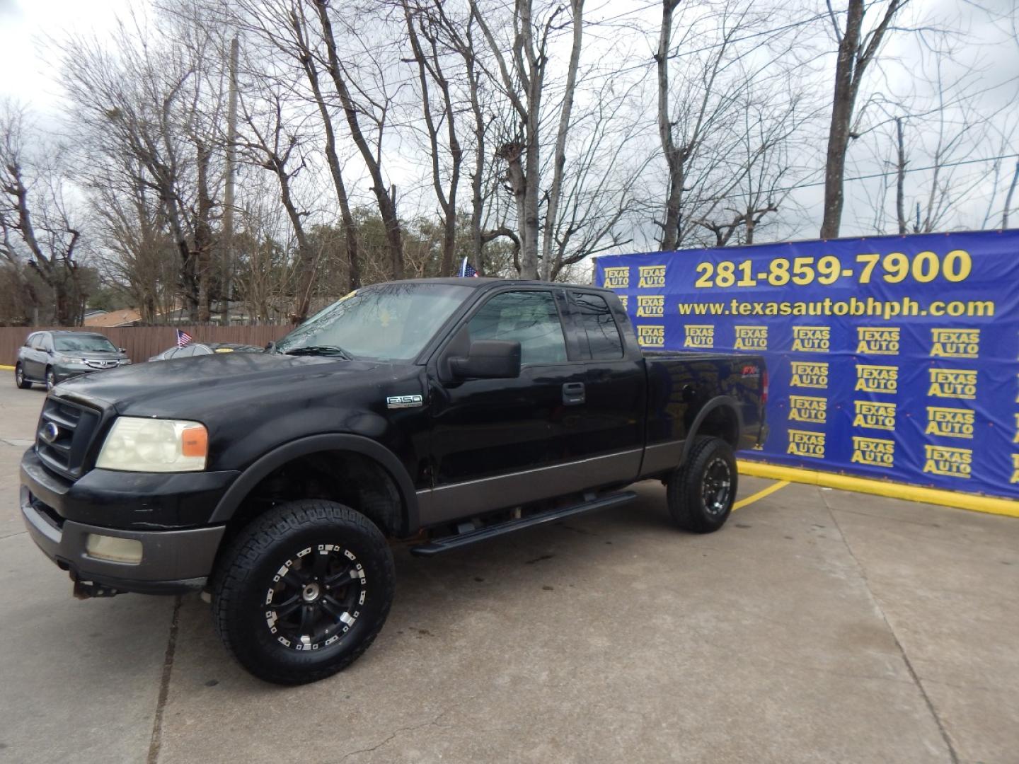 2004 BLACK Ford F-150 FX4 SuperCab 4WD (1FTPX14554N) with an 5.4L V6 SOHC 16V engine, 4-Speed Automatic Overdrive transmission, located at 16710 Clay Rd., Houston, TX, 77084, (281) 859-7900, 0.000000, 0.000000 - Cash. - Photo#2