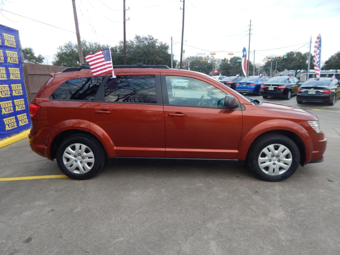 2014 ORANGE Dodge Journey SE (3C4PDCAB8ET) with an 2.4L L4 DOHC 16V engine, 4-Speed Automatic transmission, located at 16710 Clay Rd., Houston, TX, 77084, (281) 859-7900, 0.000000, 0.000000 - Low Down. Low Payments. - Photo#4