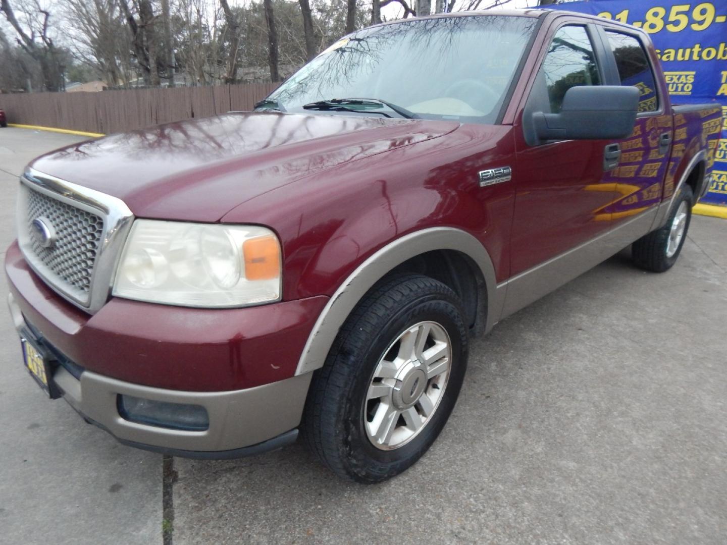 2005 MAROON Ford F-150 Lariat SuperCrew 2WD (1FTPW12555K) with an 5.4L V6 SOHC 16V engine, 4-Speed Automatic Overdrive transmission, located at 16710 Clay Rd., Houston, TX, 77084, (281) 859-7900, 0.000000, 0.000000 - Low Down. Low Payments. - Photo#1