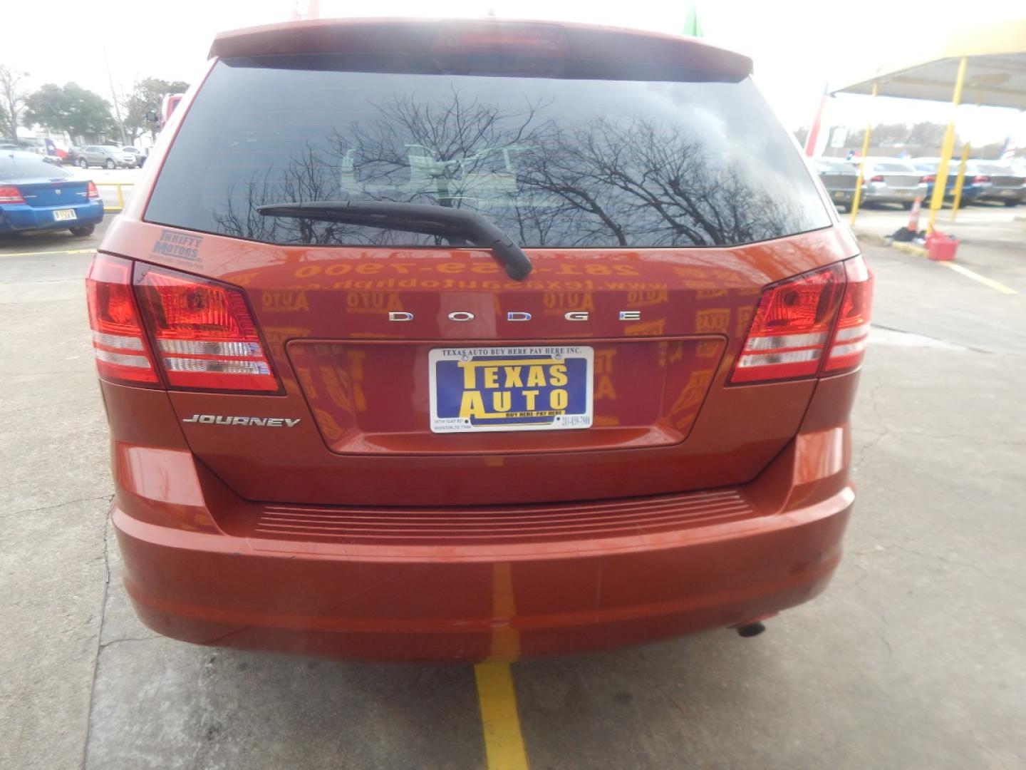 2014 ORANGE DODGE JOURNEY SE (3C4PDCAB7ET) with an 2.4L L4 DOHC 16V engine, 4-SPEED AUTOMATIC transmission, located at 16710 Clay Rd., Houston, TX, 77084, (281) 859-7900, 0.000000, 0.000000 - Low Donw. Low Payments. - Photo#5