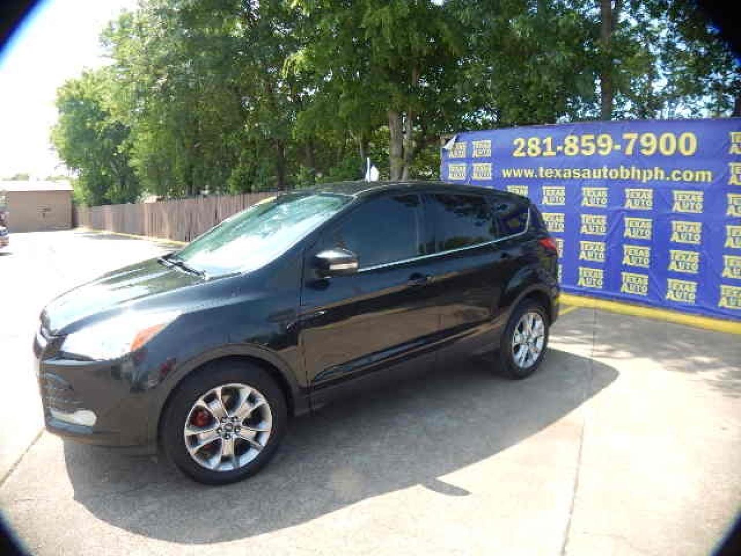 2013 BLACK Ford Escape SEL 4WD (1FMCU9H97DU) with an 2.0L L4 DOHC 16V engine, 6-Speed Automatic transmission, located at 16710 Clay Rd., Houston, TX, 77084, (281) 859-7900, 0.000000, 0.000000 - Low Down. Low Payments. - Photo#2