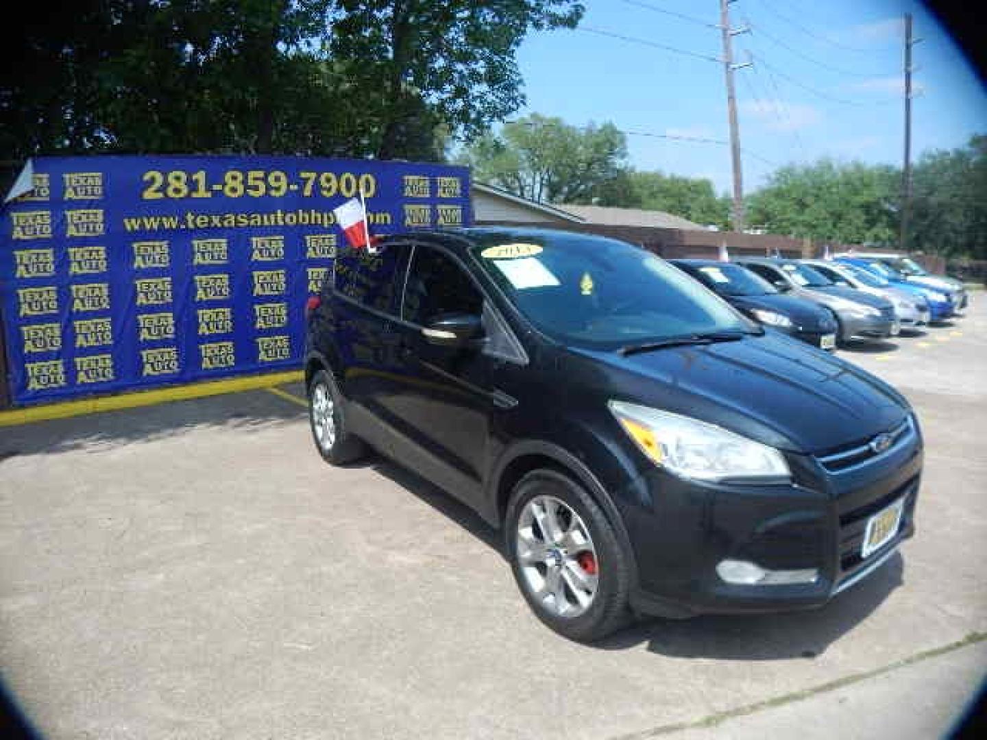 2013 BLACK Ford Escape SEL 4WD (1FMCU9H97DU) with an 2.0L L4 DOHC 16V engine, 6-Speed Automatic transmission, located at 16710 Clay Rd., Houston, TX, 77084, (281) 859-7900, 0.000000, 0.000000 - Low Down. Low Payments. - Photo#3