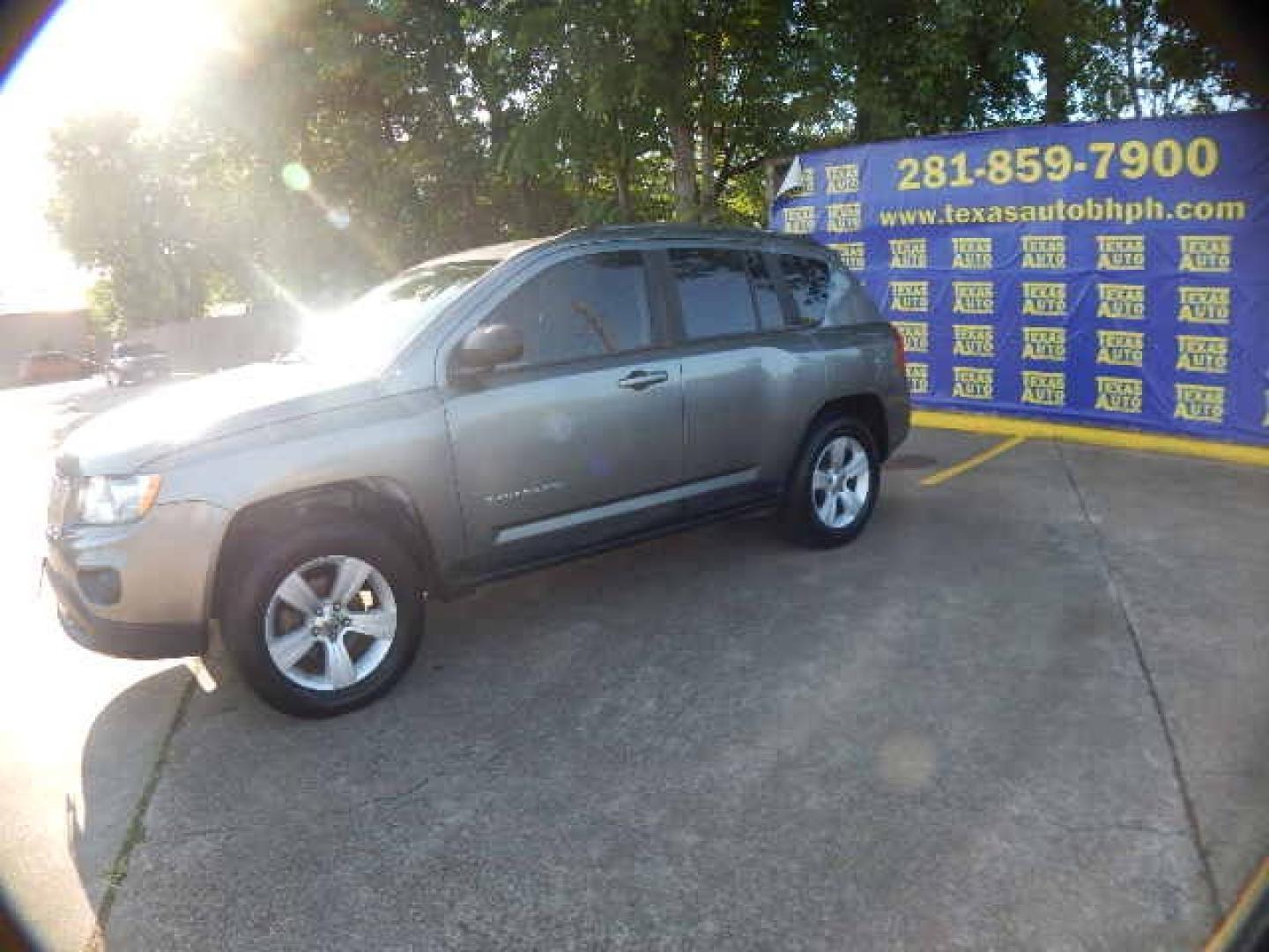 2011 GRAY Jeep Compass Sport 4WD (1J4NF1FBXBD) with an 2.4L L4 DOHC 16V engine, located at 16710 Clay Rd., Houston, TX, 77084, (281) 859-7900, 0.000000, 0.000000 - Low Down. Low Payments. - Photo#2