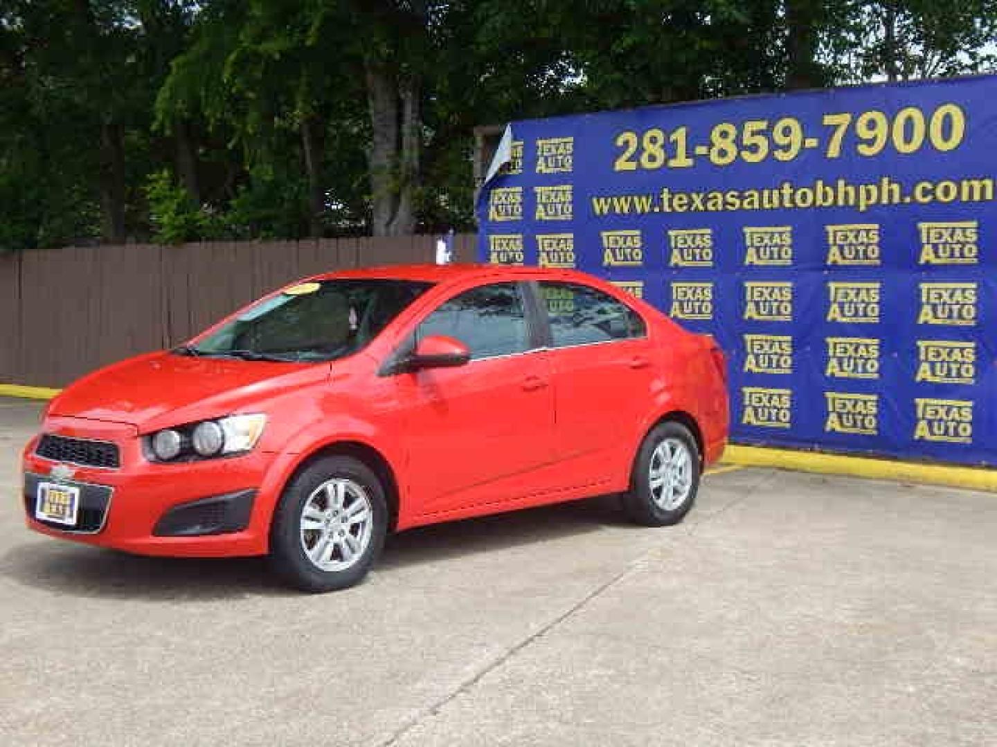 2014 RED Chevrolet Sonic LT Auto Sedan (1G1JC5SH2E4) with an 1.8L L4 DOHC 24V engine, 6-Speed Automatic transmission, located at 16710 Clay Rd., Houston, TX, 77084, (281) 859-7900, 0.000000, 0.000000 - Low Down. Low Payments. - Photo#2