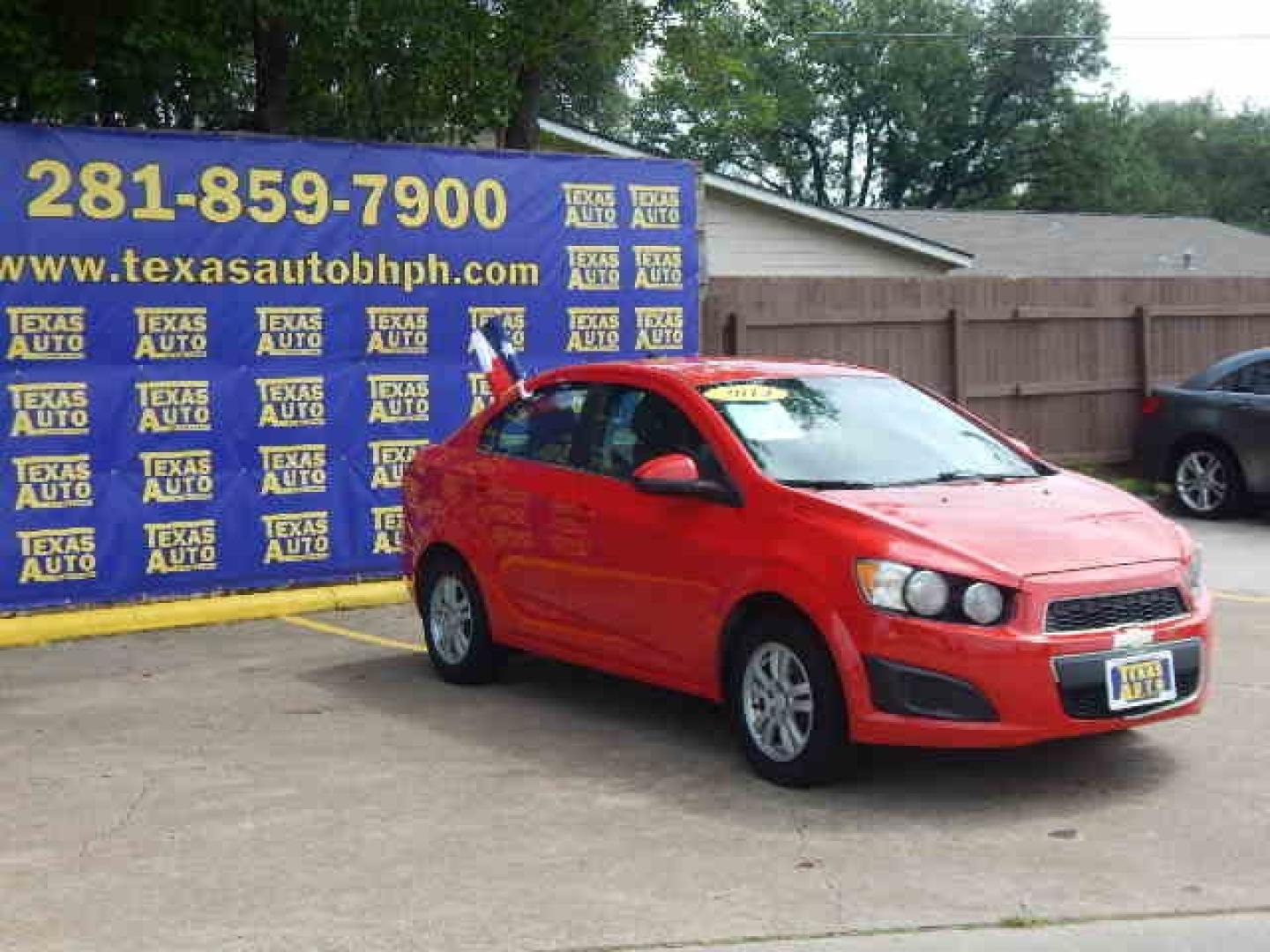 2014 RED Chevrolet Sonic LT Auto Sedan (1G1JC5SH2E4) with an 1.8L L4 DOHC 24V engine, 6-Speed Automatic transmission, located at 16710 Clay Rd., Houston, TX, 77084, (281) 859-7900, 0.000000, 0.000000 - Low Down. Low Payments. - Photo#3