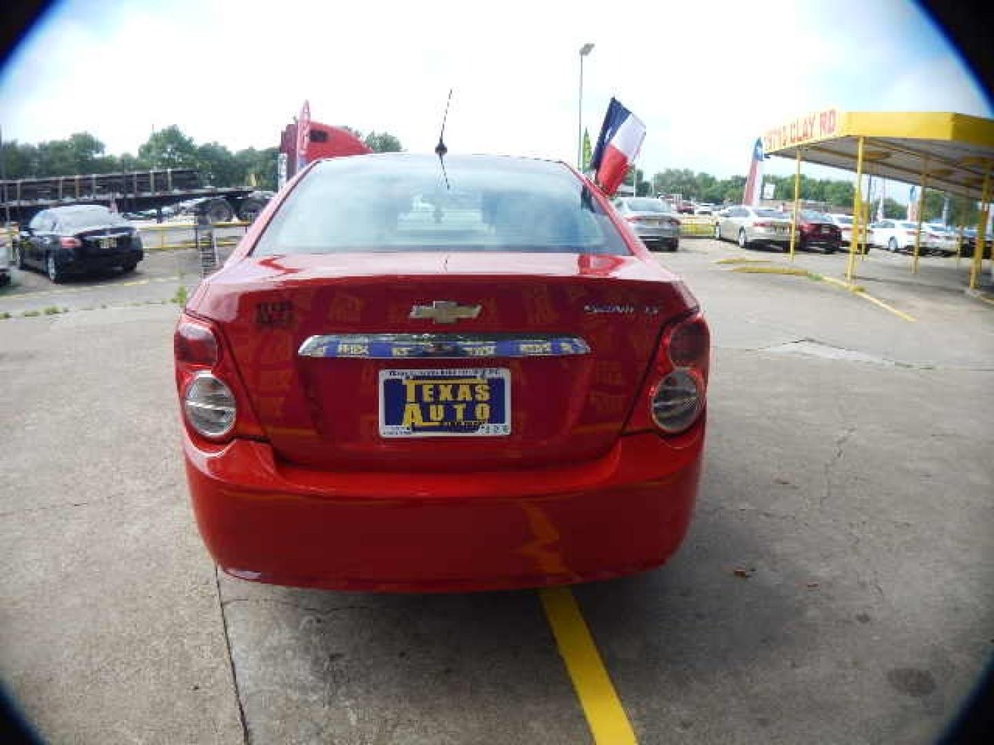 2014 RED Chevrolet Sonic LT Auto Sedan (1G1JC5SH2E4) with an 1.8L L4 DOHC 24V engine, 6-Speed Automatic transmission, located at 16710 Clay Rd., Houston, TX, 77084, (281) 859-7900, 0.000000, 0.000000 - Low Down. Low Payments. - Photo#5