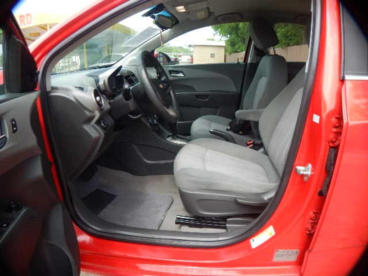 2014 RED Chevrolet Sonic LT Auto Sedan (1G1JC5SH2E4) with an 1.8L L4 DOHC 24V engine, 6-Speed Automatic transmission, located at 16710 Clay Rd., Houston, TX, 77084, (281) 859-7900, 0.000000, 0.000000 - Low Down. Low Payments. - Photo#6