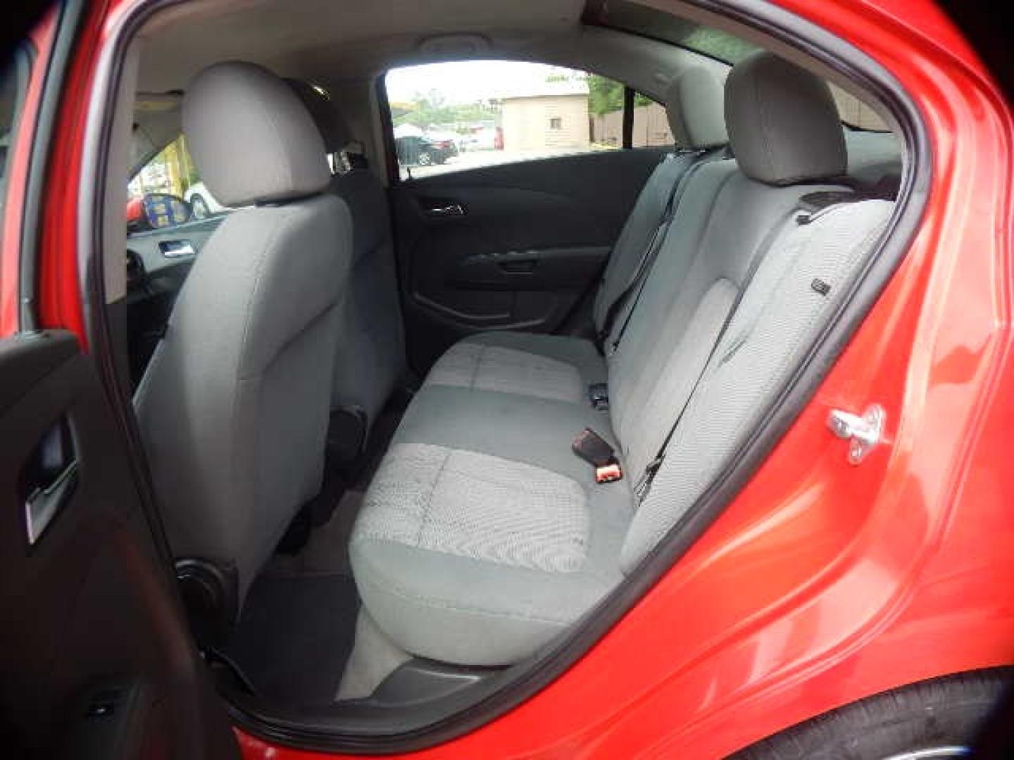 2014 RED Chevrolet Sonic LT Auto Sedan (1G1JC5SH2E4) with an 1.8L L4 DOHC 24V engine, 6-Speed Automatic transmission, located at 16710 Clay Rd., Houston, TX, 77084, (281) 859-7900, 0.000000, 0.000000 - Low Down. Low Payments. - Photo#7