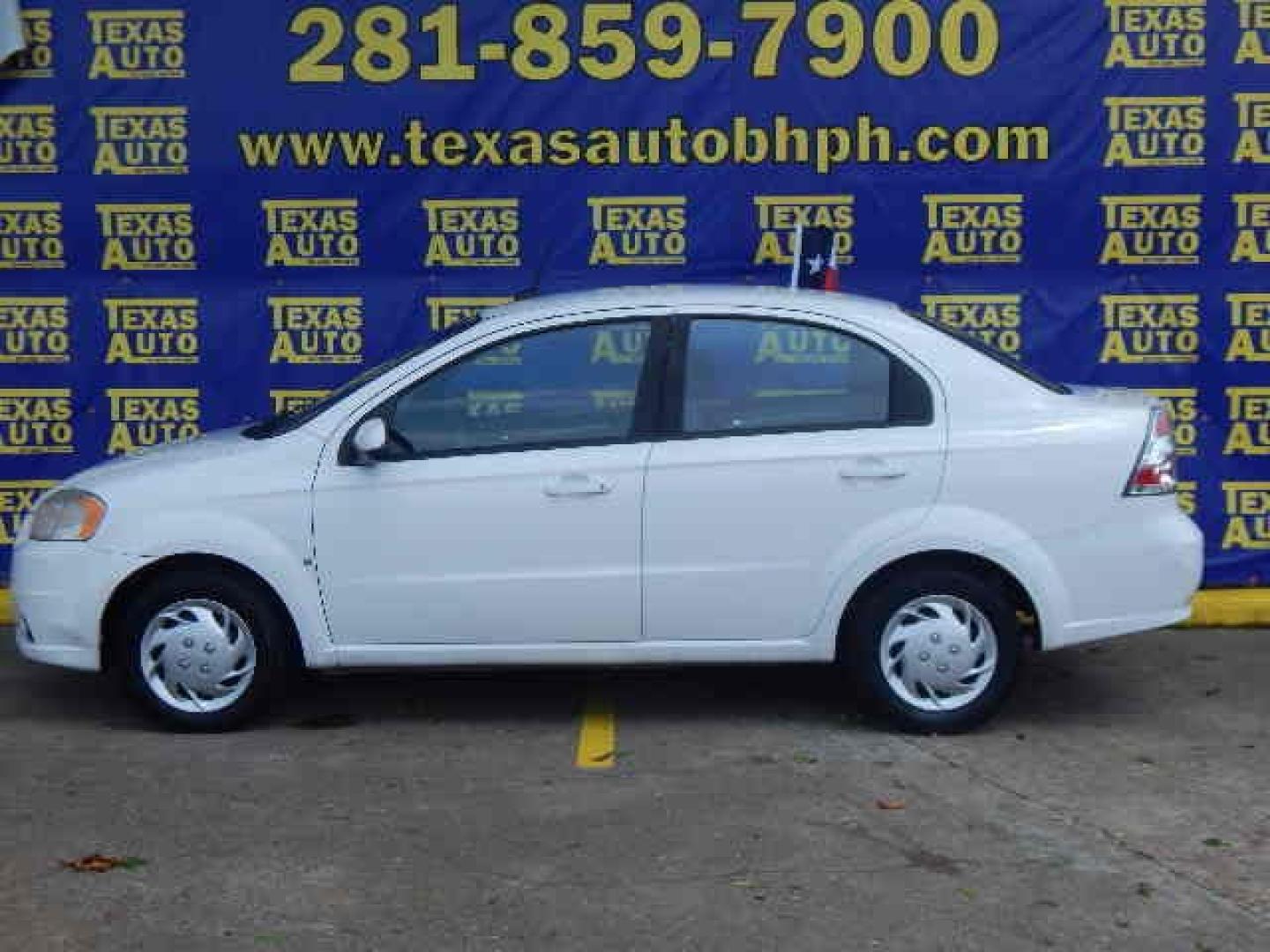 2009 WHITE Chevrolet Aveo LS (KL1TD56E69B) with an 1.6L L4 DOHC 16V engine, located at 16710 Clay Rd., Houston, TX, 77084, (281) 859-7900, 0.000000, 0.000000 - Low Down. Low Payments. - Photo#0