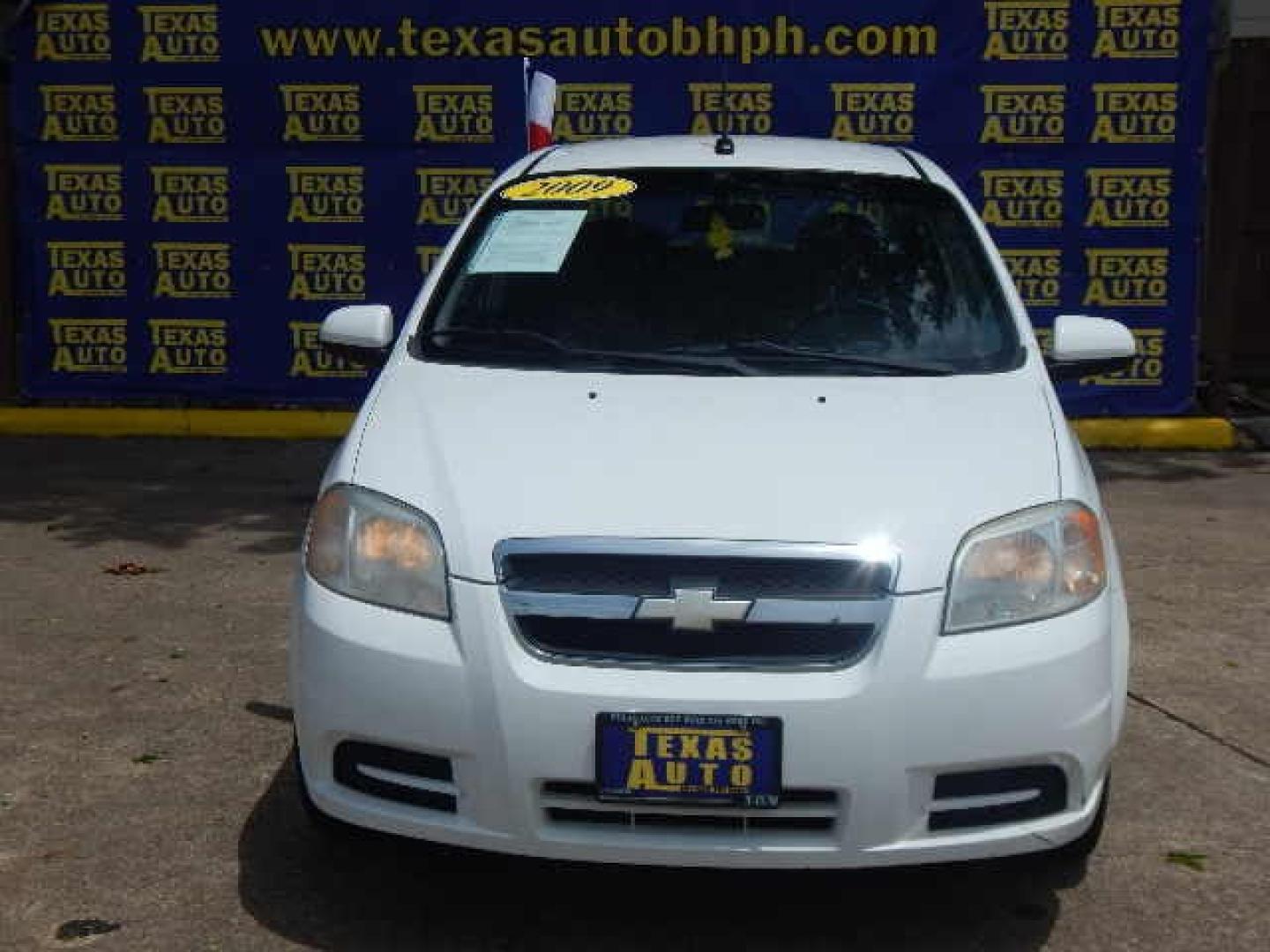 2009 WHITE Chevrolet Aveo LS (KL1TD56E69B) with an 1.6L L4 DOHC 16V engine, located at 16710 Clay Rd., Houston, TX, 77084, (281) 859-7900, 0.000000, 0.000000 - Low Down. Low Payments. - Photo#1