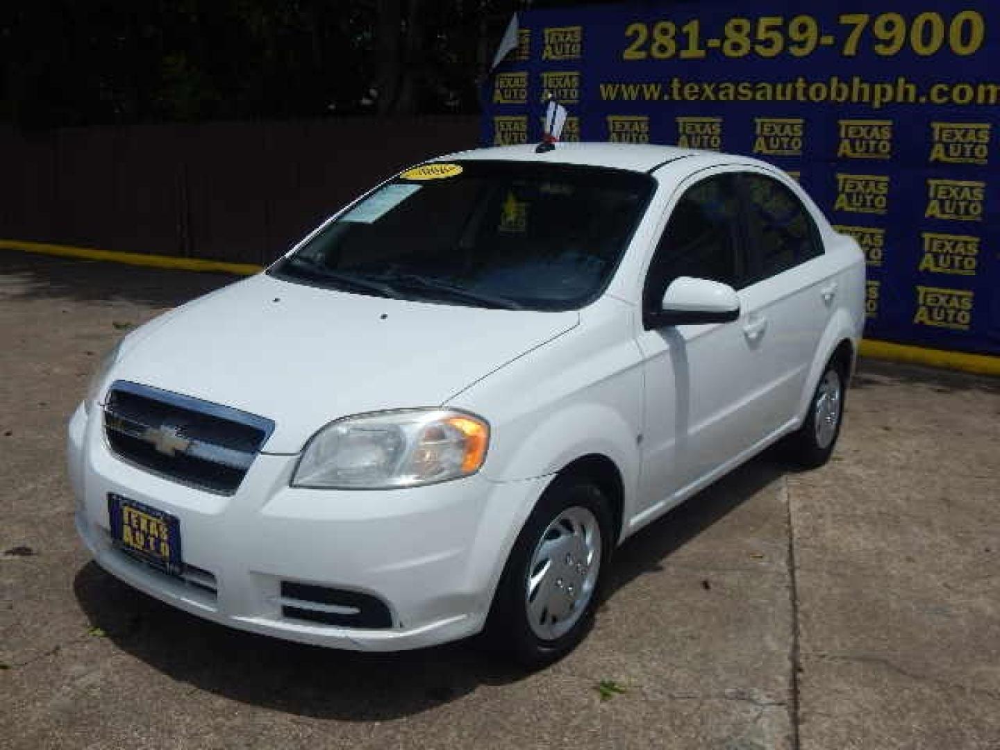 2009 WHITE Chevrolet Aveo LS (KL1TD56E69B) with an 1.6L L4 DOHC 16V engine, located at 16710 Clay Rd., Houston, TX, 77084, (281) 859-7900, 0.000000, 0.000000 - Low Down. Low Payments. - Photo#2