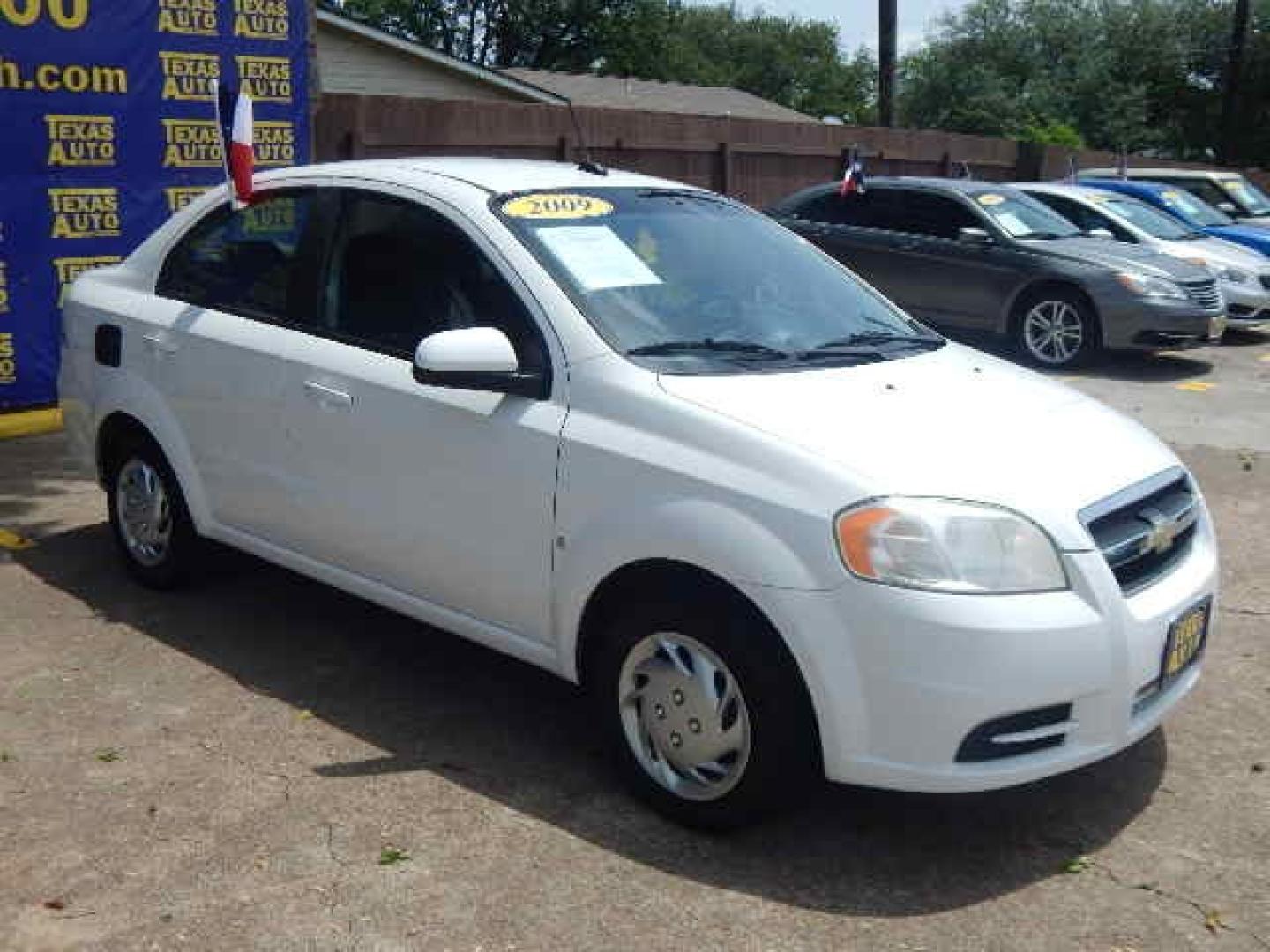 2009 WHITE Chevrolet Aveo LS (KL1TD56E69B) with an 1.6L L4 DOHC 16V engine, located at 16710 Clay Rd., Houston, TX, 77084, (281) 859-7900, 0.000000, 0.000000 - Low Down. Low Payments. - Photo#3