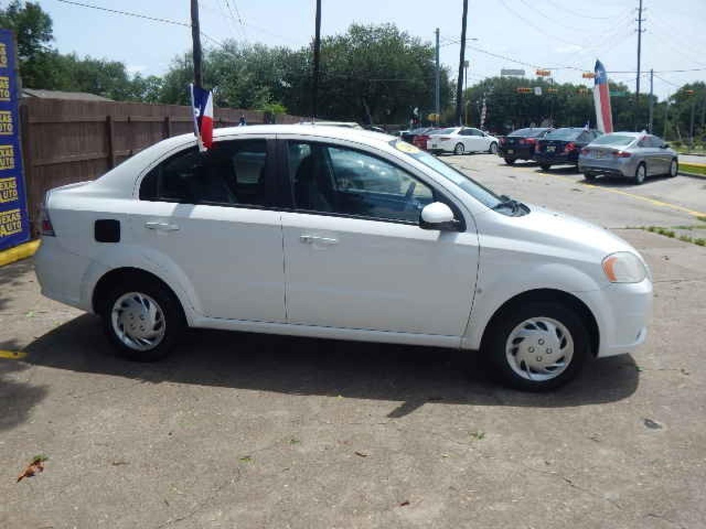 2009 WHITE Chevrolet Aveo LS (KL1TD56E69B) with an 1.6L L4 DOHC 16V engine, located at 16710 Clay Rd., Houston, TX, 77084, (281) 859-7900, 0.000000, 0.000000 - Low Down. Low Payments. - Photo#4