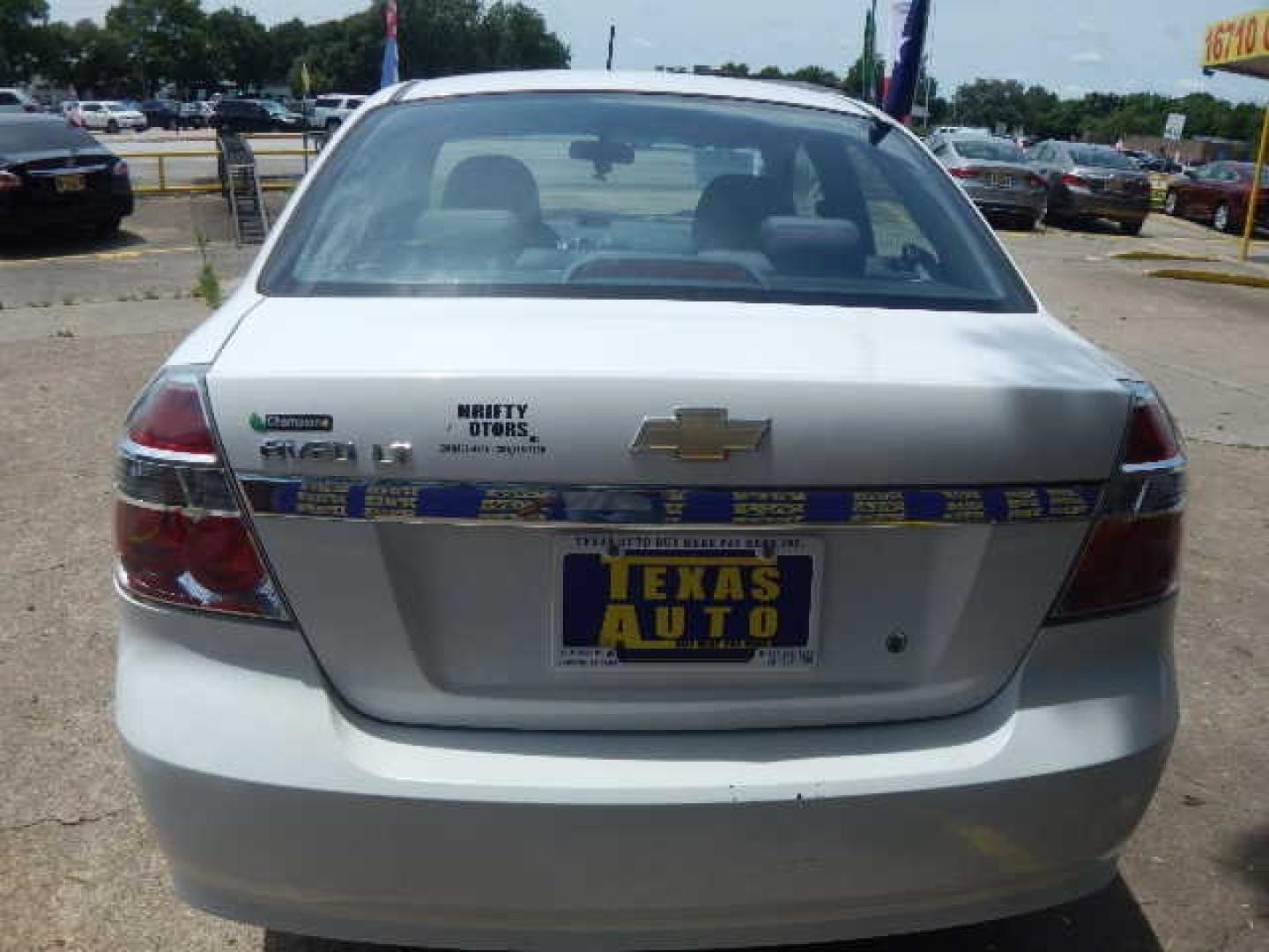 2009 WHITE Chevrolet Aveo LS (KL1TD56E69B) with an 1.6L L4 DOHC 16V engine, located at 16710 Clay Rd., Houston, TX, 77084, (281) 859-7900, 0.000000, 0.000000 - Low Down. Low Payments. - Photo#5