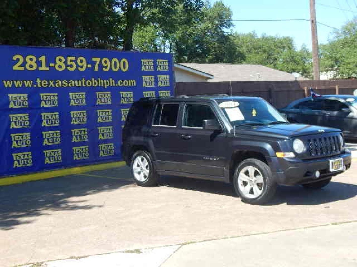 2014 BLACK Jeep Patriot Latitude 2WD (1C4NJPFA4ED) with an 2.0L L4 DOHC 16V engine, located at 16710 Clay Rd., Houston, TX, 77084, (281) 859-7900, 0.000000, 0.000000 - Low Down. Low Payments. - Photo#3