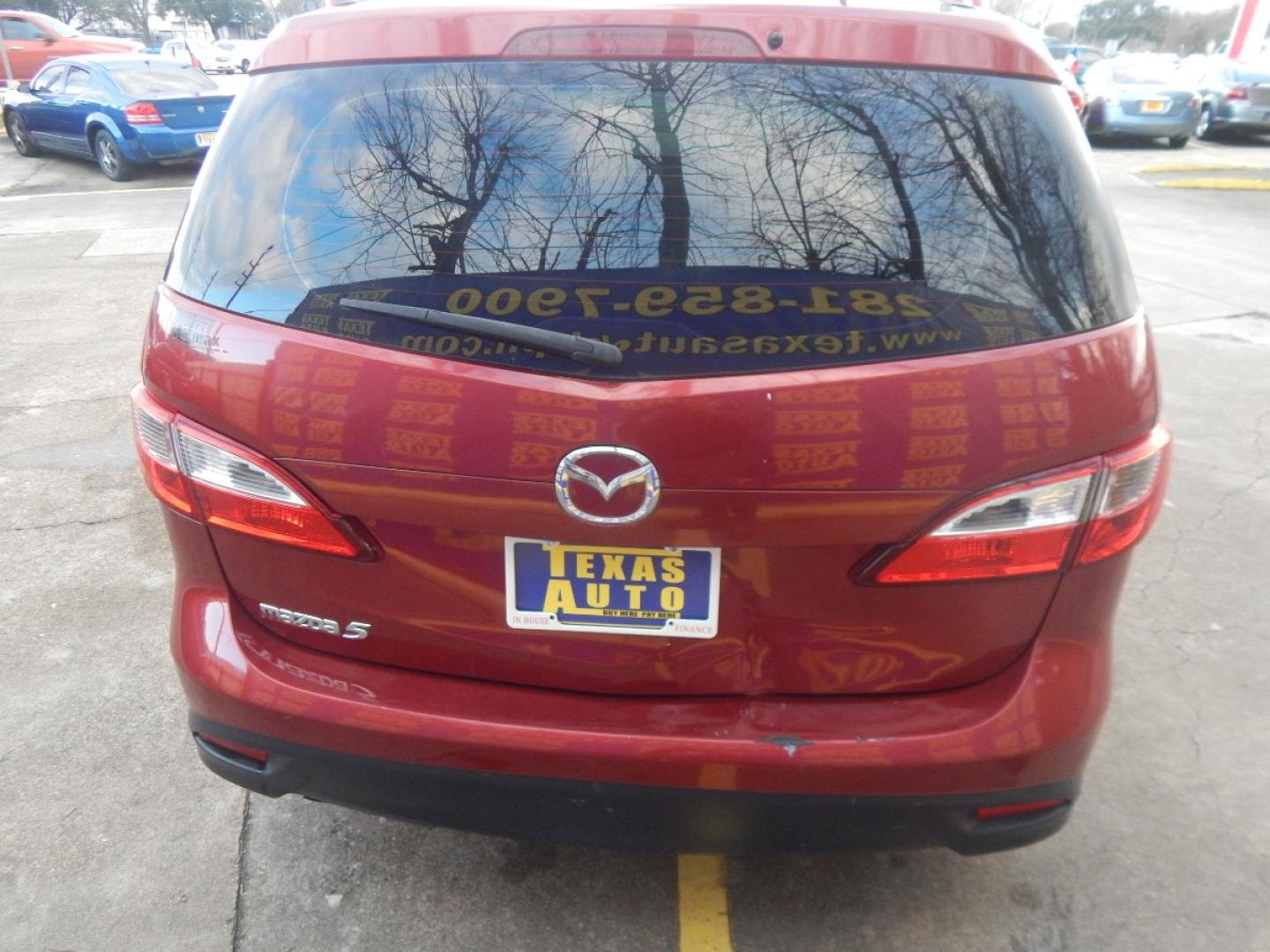 2014 RED MAZDA MAZDA5 Sport AT (JM1CW2BL6E0) with an 2.5L L4 DOHC 16V engine, 5-SPEED AUTOMATIC transmission, located at 16710 Clay Rd., Houston, TX, 77084, (281) 859-7900, 0.000000, 0.000000 - Low Donw. Low Payments. - Photo#5