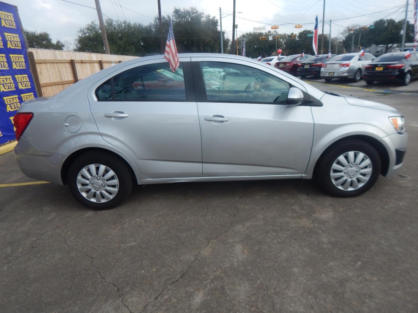 2015 GRAY CHEVROLET SONIC LS Auto Sedan (1G1JA5SH6F4) with an 1.8L L4 DOHC 24V engine, 6-SPEED AUTOMATIC transmission, located at 16710 Clay Rd., Houston, TX, 77084, (281) 859-7900, 0.000000, 0.000000 - Low Donw. Low Payments. - Photo#4