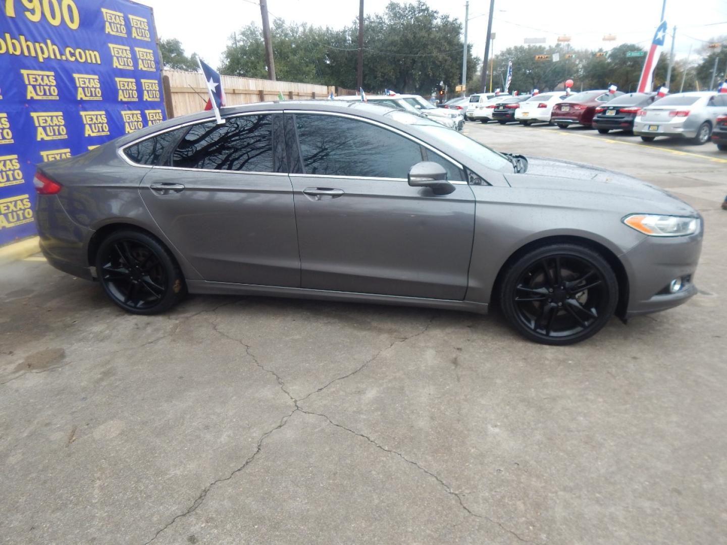 2013 GRAY FORD FUSION Titanium (3FA6P0K95DR) with an 2.0L L4 DOHC 16V engine, AUTOMATIC transmission, located at 16710 Clay Rd., Houston, TX, 77084, (281) 859-7900, 0.000000, 0.000000 - Low Donw. Low Payments. - Photo#4