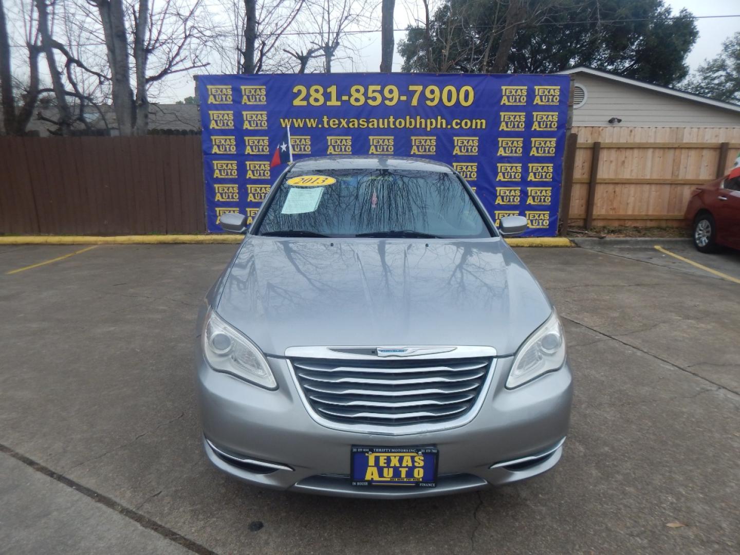 2013 SILVER CHRYSLER 200 LX (1C3CCBABXDN) with an 2.4L L4 DOHC 16V engine, 6-SPEED AUTOMATIC transmission, located at 16710 Clay Rd., Houston, TX, 77084, (281) 859-7900, 0.000000, 0.000000 - Low Donw. Low Payments. - Photo#1