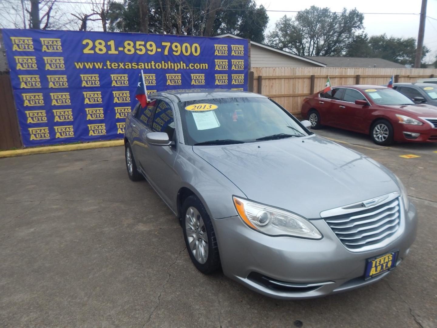 2013 SILVER CHRYSLER 200 LX (1C3CCBABXDN) with an 2.4L L4 DOHC 16V engine, 6-SPEED AUTOMATIC transmission, located at 16710 Clay Rd., Houston, TX, 77084, (281) 859-7900, 0.000000, 0.000000 - Low Donw. Low Payments. - Photo#3